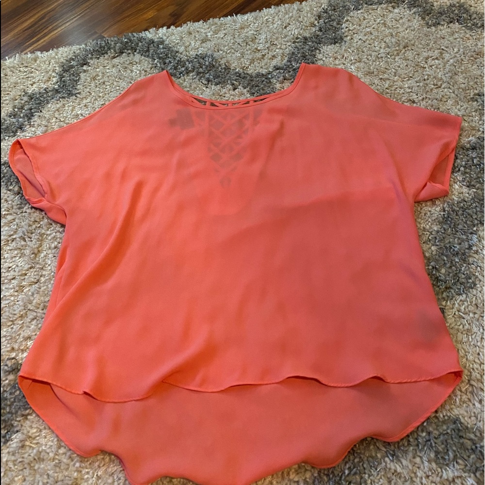 cute shirt, hole in arms, back has cute design
